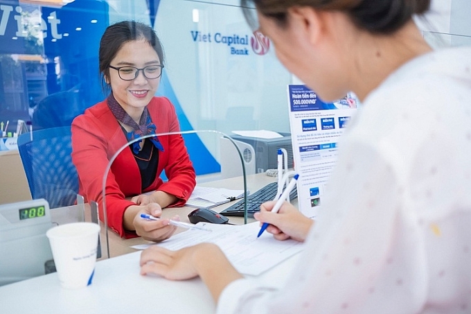 Ngân hàng cộng lãi suất tới 0,7% cho khách nữ gửi tiền ngan hang cong lai suat toi 07 cho khach nu gui tien